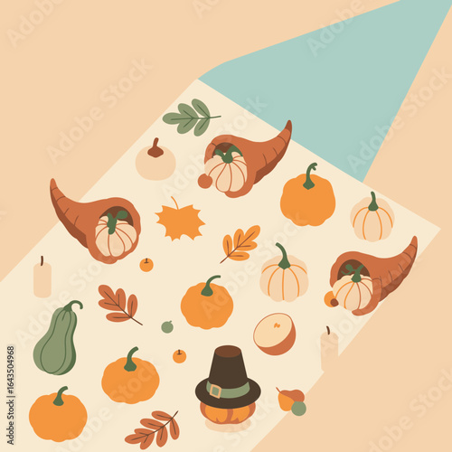 Thanksgiving themed flat lay with decorative elements. Arrangement of gourds, pumpkins, cornucopias, leaves, and autumnal items on a cream-colored surface.