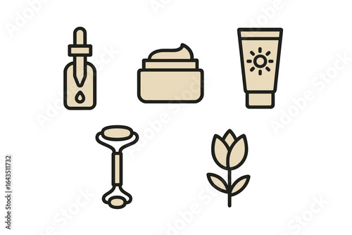 Cosmetic products and tools arranged for skincare routine on a clean background