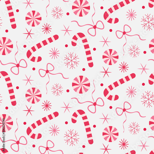 Cute Christmas candy canes and sticks with bows and snow in red and pink seamless pattern on white background. For Fabric, textile and Christmas decoration
