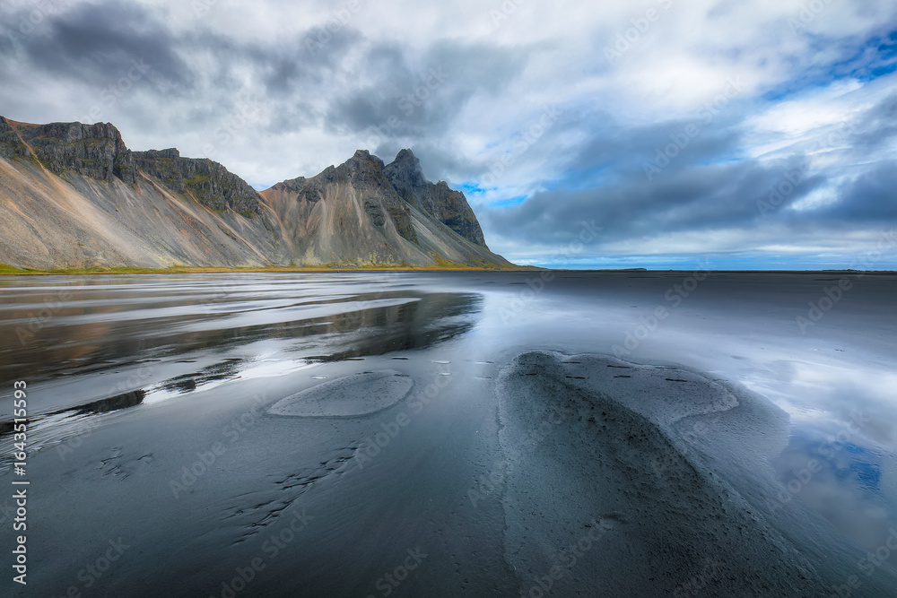 Fototapeta premium Amazing view on black sand beach on Stokksnes cape in Iceland.