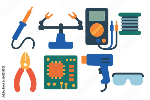Collection of electronic tools and components used for circuit assembly and repair in a workshop setting