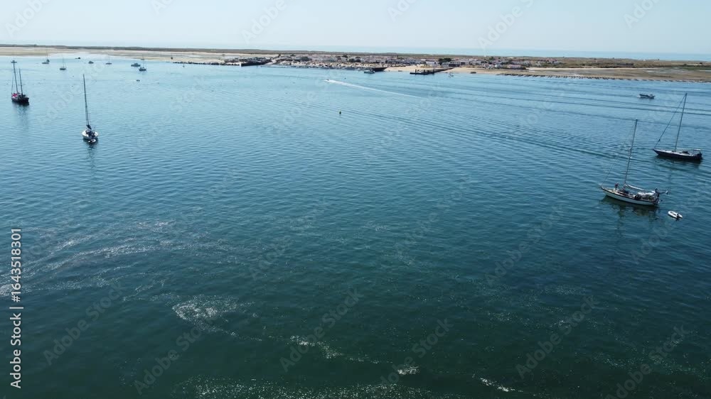 Drone approach over Ria Formosa towards the Culatra Island in Algarve, Portugal. Drone approach over Ria Formosa towards the Culatra Island in Algarve, Portugal.