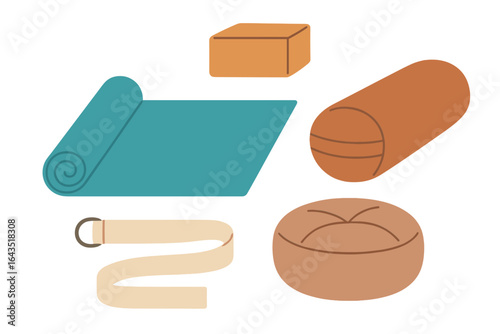 Yoga accessories including mat, blocks, bolster, strap, and cushion arranged on flat surface during afternoon practice session