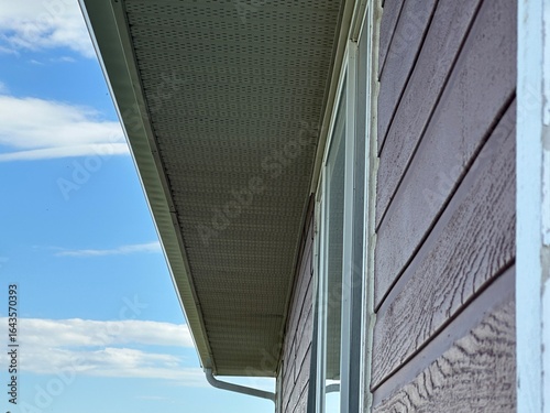 Close-up view of roofing soffit installation on residential home
