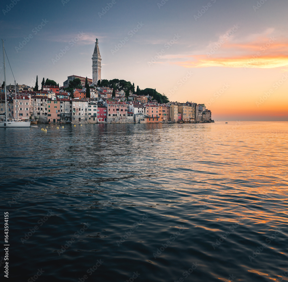 Fototapeta premium Rovinj Old Town at Sunset with Sailboats on the Adriatic Coast