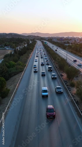 Vertical video of cars on the highway - 4k drone footage of cars driving on the highway