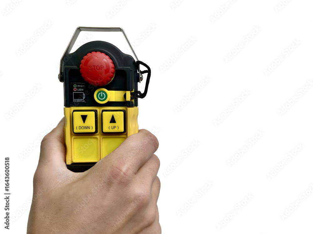 Fototapeta premium Industrial remote control in hand isolated on white background