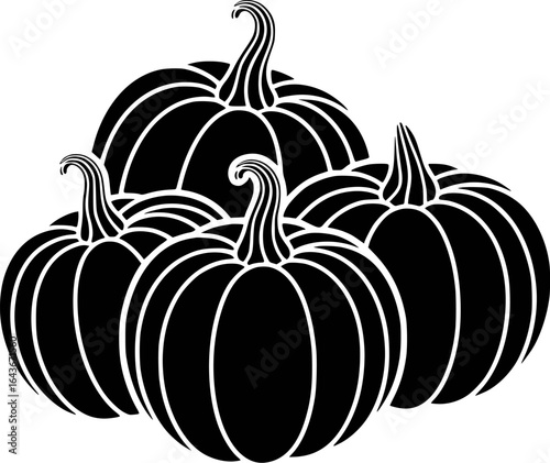 Black pumpkins arranged in a cluster gourd squash