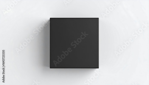 Top down view of a matte black square box with clean edges on a white background simple minimalist design