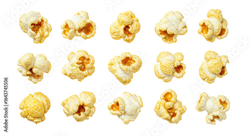 Scattered individual popped popcorn pieces isolated on white background