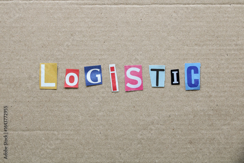 Logistic word colorful paper letters cutouts on cardboard