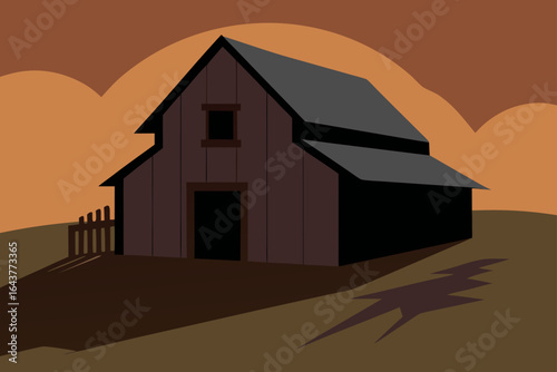 Rustic wooden barn with a dark roof and fence at sunset