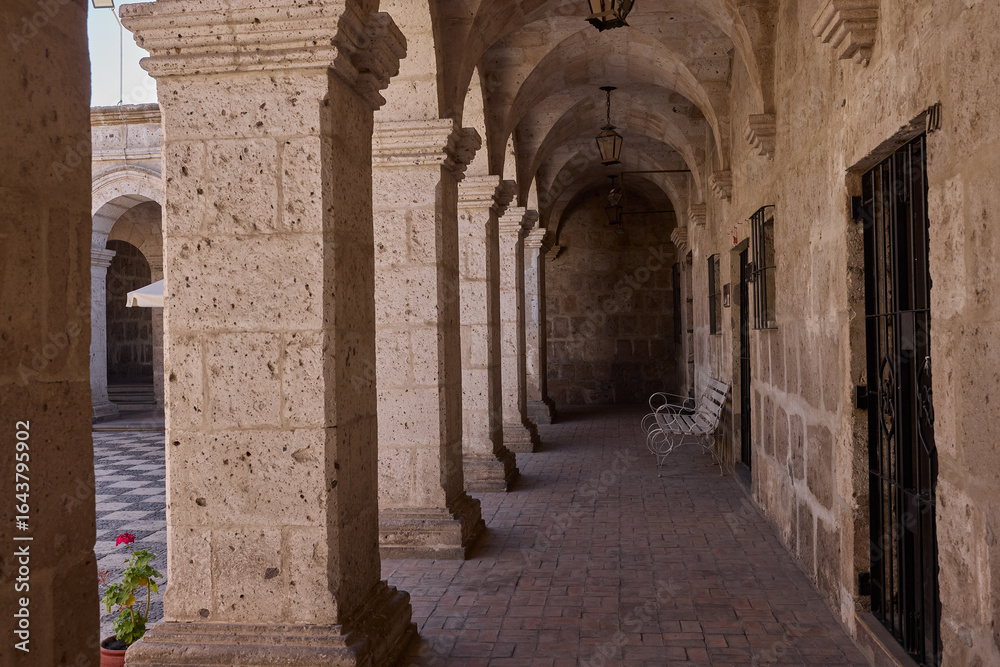 Fototapeta premium The Cloisters of the Company showcase elegant colonial architecture carved from white volcanic sillar. Once part of a Jesuit complex, these arcaded courtyards now blend history and art.