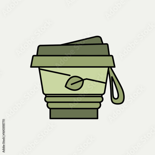 Collapsible green cup with leaf logo and strap on light background.