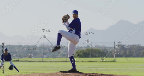 Fotografía Pitching pitcher wearing cap gripping ball and glove on mound chainlink fence an