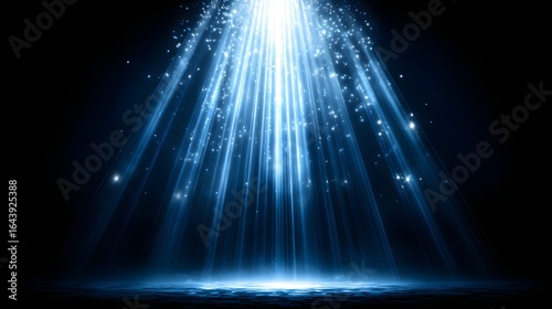 Light beams radiating from above, illuminating a dark stage.