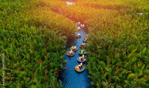 Quadro su tela Scenic aerial view of round boats in hoi an waterways surrounded by lush greener