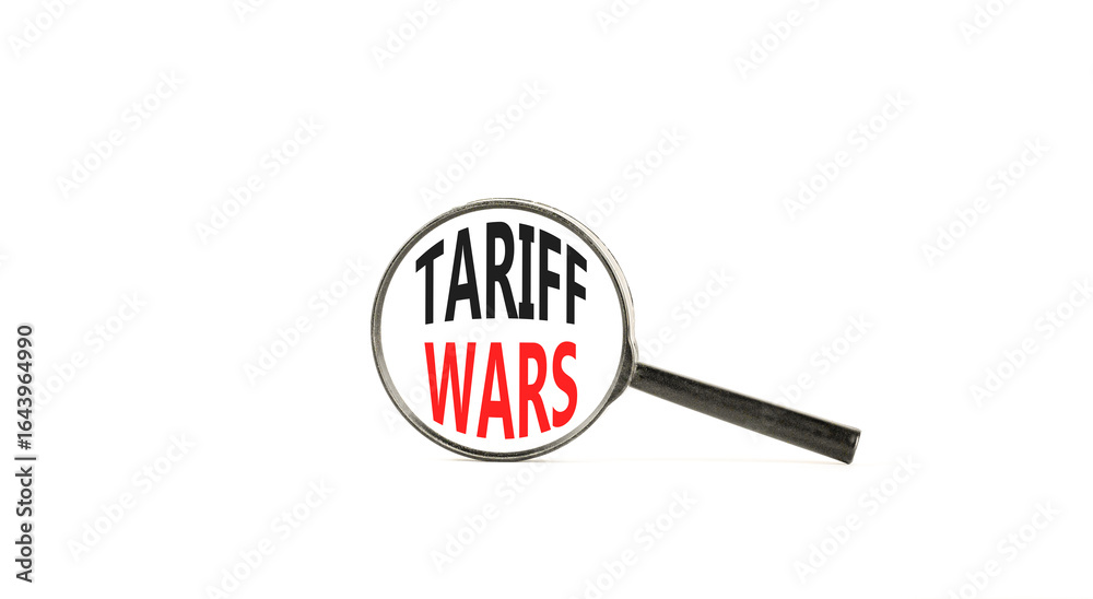 Trade tariff wars symbol. Concept word Tariff wars on beautiful magnifying glass. Beautiful white paper background. Black magnifying glass. Business trade tariff wars concept concept. Copy space. Trade tariff wars symbol. Concept word Tariff wars on beautiful magnifying glass. Beautiful white paper background. Black magnifying glass. Business trade tariff wars concept concept. Copy space.