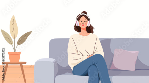 Serene Woman Relaxing on Sofa Listening to Music with Closed Eyes.