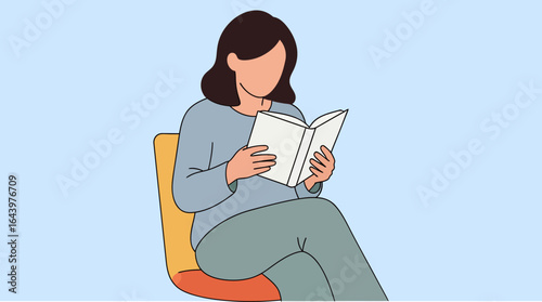 Woman Reading a Book While Seated in a Modern Colorful Chair.