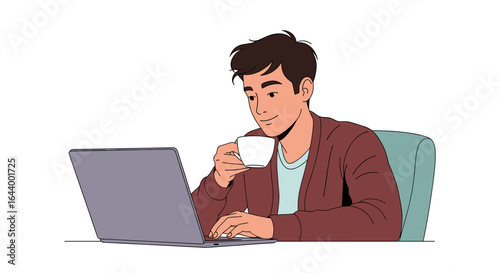Young man sitting at a desk working on his laptop and drinking coffee
