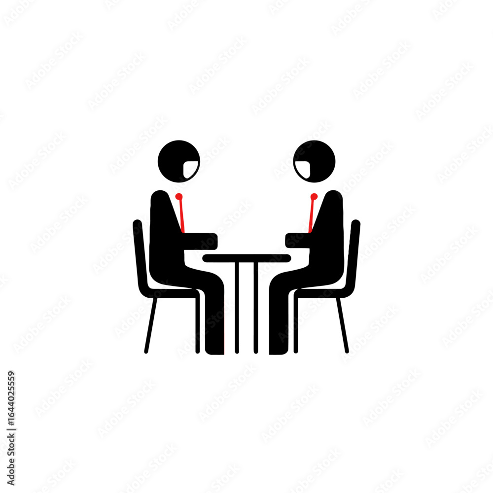Fototapeta premium Two individuals in suits engaged in a meeting at a small table.