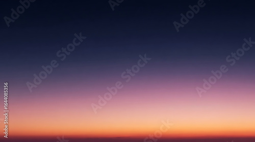 Deep indigo fading to soft lavender and warm peach hues sunset twilight