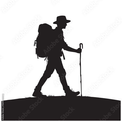Hiker walking up mountain silhouette