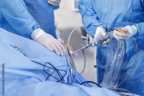 Papier peint Knee arthroscopy with PCL reconstruction using arthroscope and probe in sterile