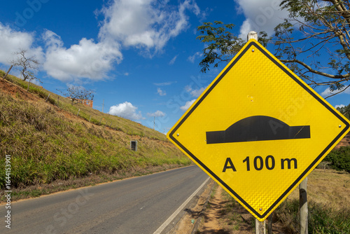 Speed bump warning sign on a stretch of highway MG 353, in the city of Guarani, state of Minas Gerais, Brazil