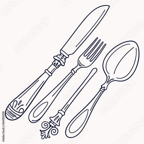 Elegant antique silverware set with ornate handles