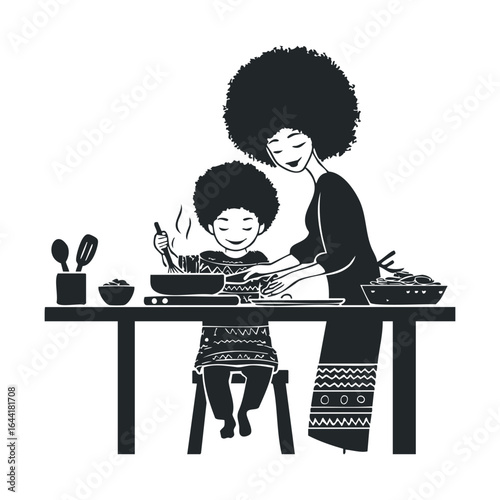 Mother and son cooking together - african family preparing a meal in the kitchen
