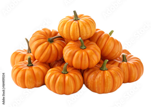 A pile of small orange pumpkins with green stems stacked on top of each other on black background