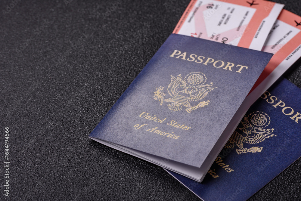 Fototapeta premium US passport or id document with tickets for flight, travel, border crossing. US passport and tickets