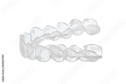 Transparent dental mouth guard for orthodontic treatment and bruxism prevention, clear plastic teeth aligner with detailed tooth impressions isolated on white background, professional closeup shot