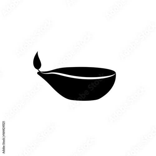 Simple Black Silhouette of a Lit Oil Lamp Representing Diwali and Other Hindu Festivals Isolated on White Background