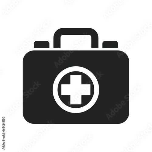 First aid kit icon. A minimal solid black silhouette of a medical suitcase with a circular emblem containing a white cross in the center, symbolizing emergency care and healthcare.
