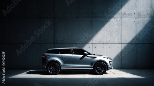 A sleek, dark-colored luxury SUV is parked in a brutalist-style concrete garage with dramatic lighting. The image conveys power, modern design, and an exclusive, high-end lifestyle.
