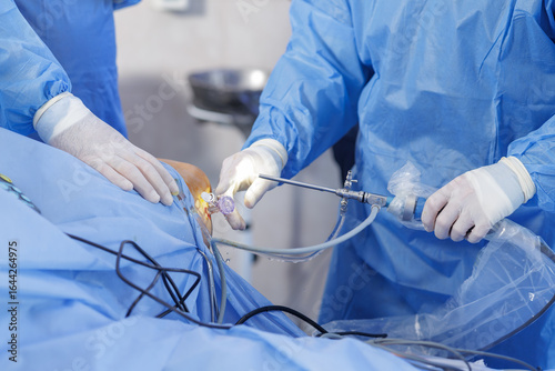 Canvas Print Knee arthroscopy with PCL reconstruction and arthroscope in sterile surgical env