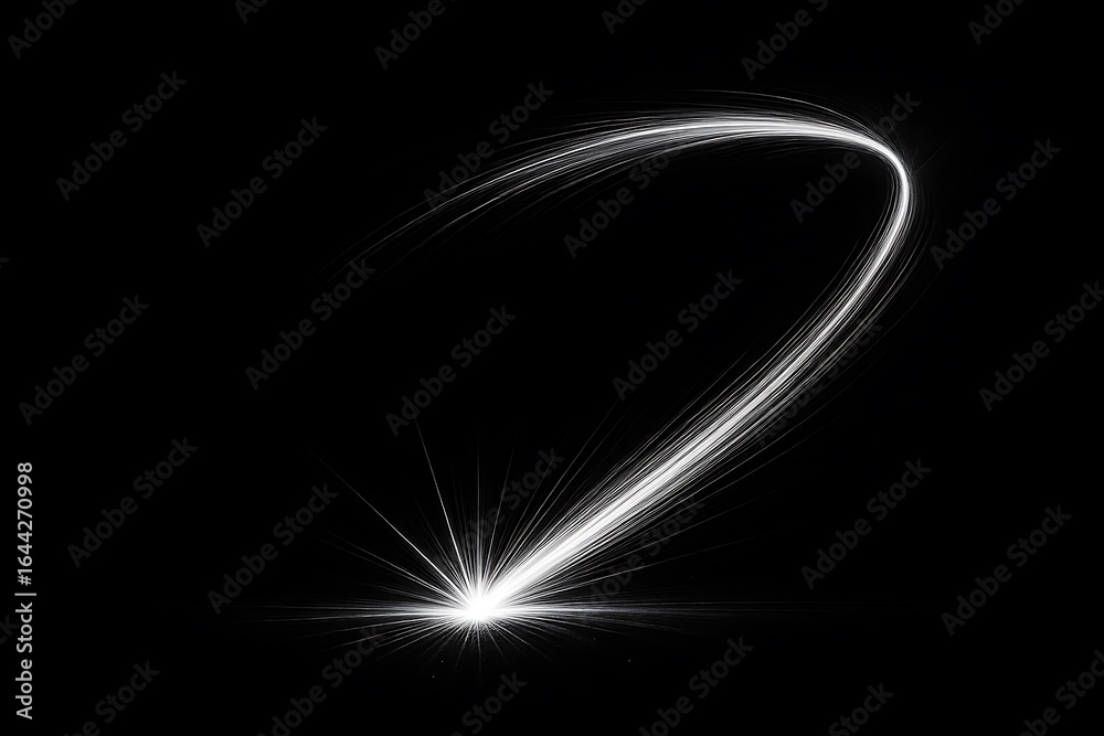 Obraz premium Dynamic white light streak forming a curved trail on black background