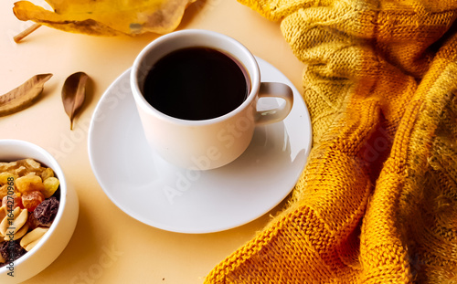 coffee in a porcelain cup and background with autumn theme and colors