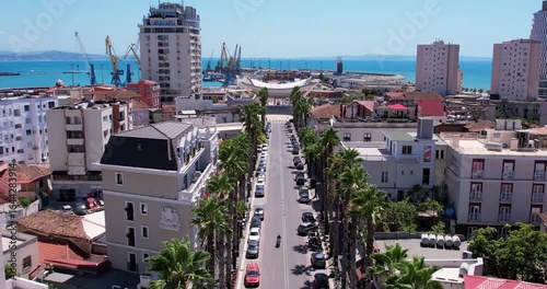 Aerial Bird's eye view of Albanian city Durres. Buildings and beach along Adriatic sea coast.