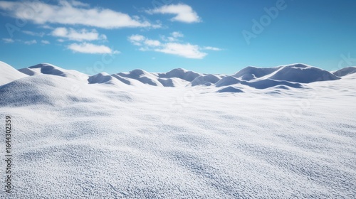 Expansive winter landscape featuring undulating snowy hills under a bright blue sky with wispy clouds