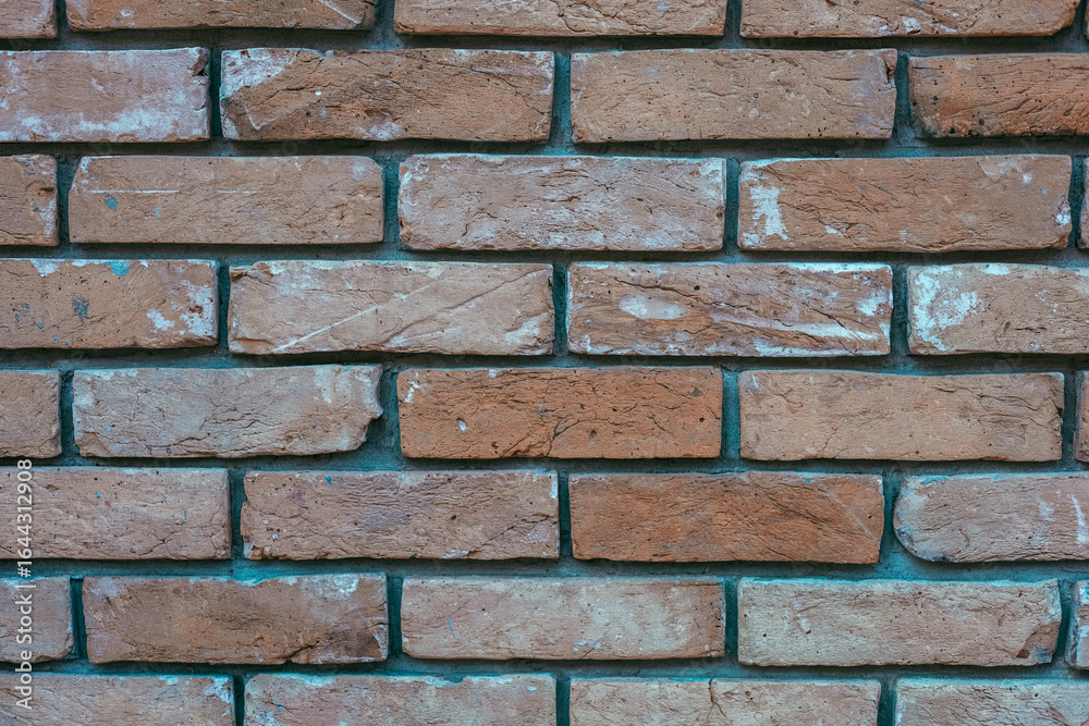 Obraz premium Brick wall texture in warm tones showcasing rustic design elements for interior or exterior use