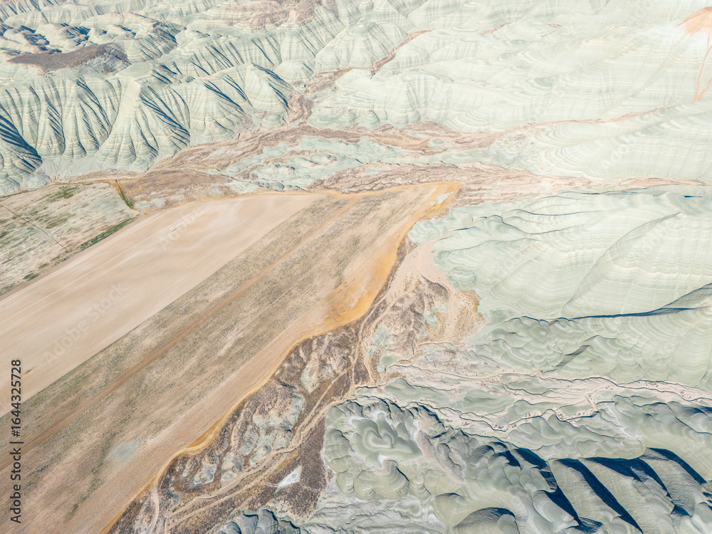 Fototapeta premium Nallıhan aerial view of vast agricultural fields blending with unique layered hills, showcasing nature's beauty and geological formations in Ankara, Turkey. Perfect for nature and travel themes.