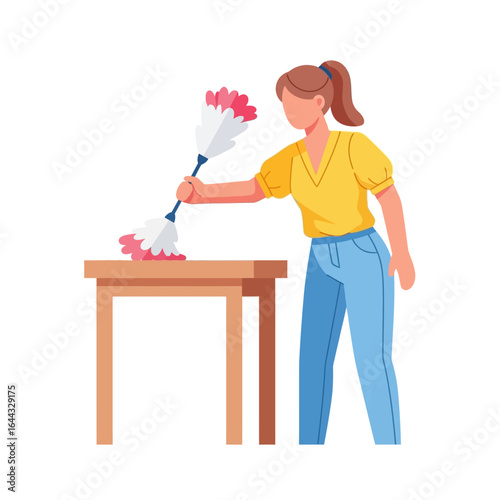 Young woman actively engaged in household chores, meticulously dusting a wooden table with a soft feather duster, illustrating domestic cleaning routine.