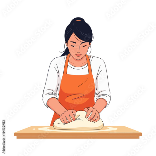Young woman in apron kneading dough on wooden table, preparing food at home