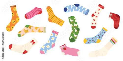 Colorful socks collection with cute patterns. Funny designs with smile faces, bananas, hearts, flowers, animals, dots, stripes, fruits. Cozy warm winter and autumn accessory. Flat vector illustration.