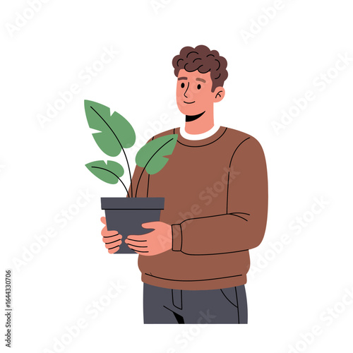 A young man happily tending to his potted houseplant, embodying a connection with nature and green living, symbolizing hobby and self-care.