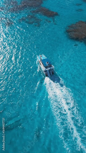 Catamaran with Tourists Sailing Over Clear Turquoise Water, Aerial View